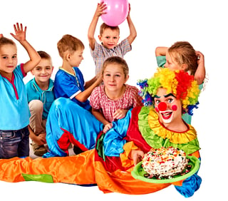 clown with children and birthday cake 