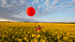 Optimistic child with balloon